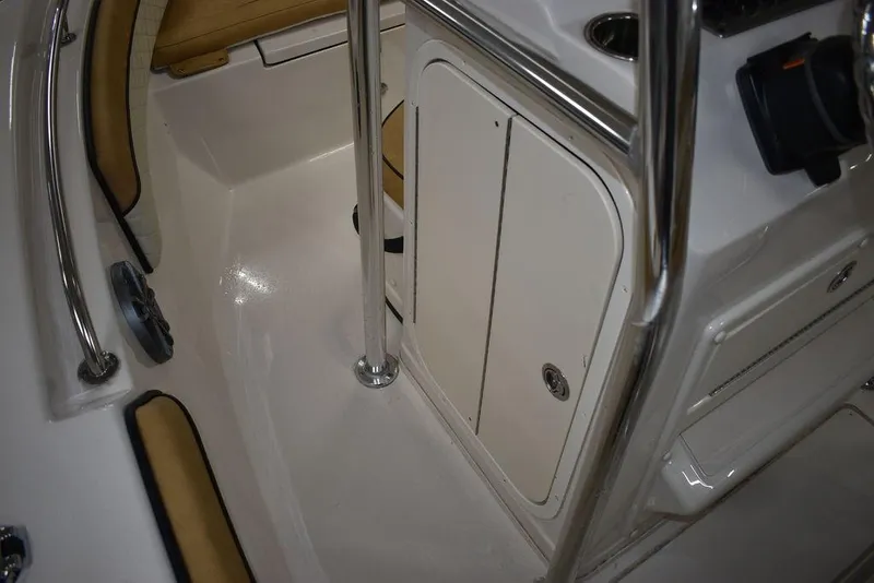 Slide: The Image of 2023 Sea Chaser 20 HFC boat interior with storage compartment and stainless steel railings. - 42