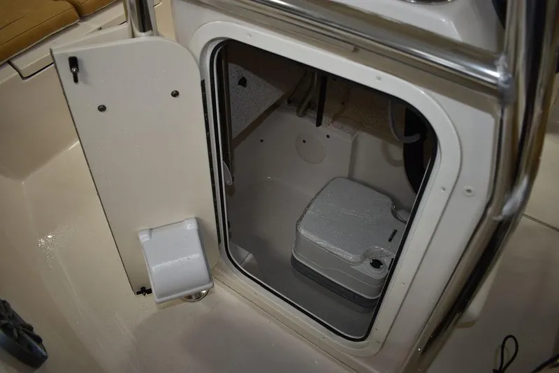 Slide: The Image of 2023 Sea Chaser 20 HFC boat interior with storage compartment and portable toilet. - 43