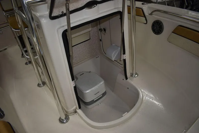 Slide: The Image of 2023 Sea Chaser 20 HFC boat interior with storage compartment and portable toilet. - 44