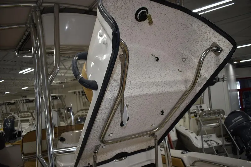 Slide: The Image of 2023 Sea Chaser 20 HFC boat with open storage compartment in showroom. - 45