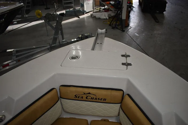 Slide: The Image of 2023 Sea Chaser 20 HFC boat interior, bow seating area in a workshop. - 46