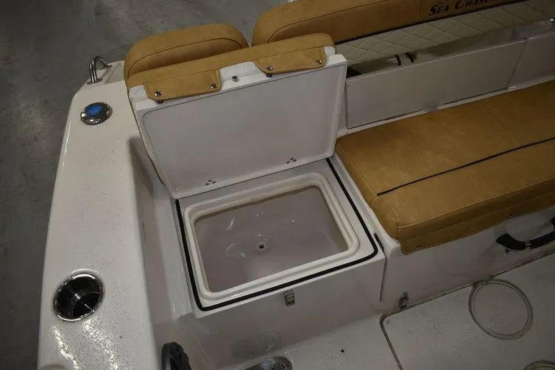 Slide: The Image of 2023 Sea Chaser 20 HFC boat with open storage compartment and cushioned seating. - 48