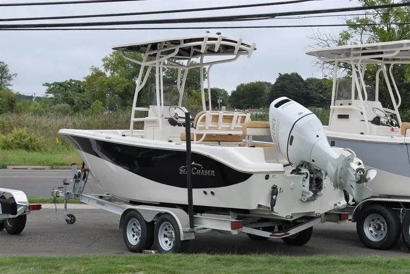 The Image of 2023 Sea Chaser 22 HFC boat on a trailer, side view. - 0