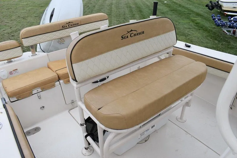 Slide: The Image of 2023 Sea Chaser 22 HFC boat interior with tan cushioned seating. - 13