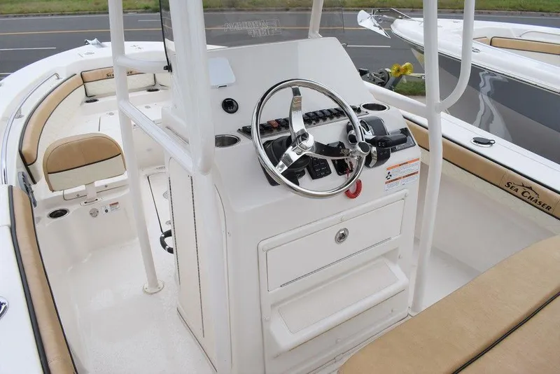 Slide: The Image of 2023 Sea Chaser 22 HFC boat interior with steering console and seating. - 6