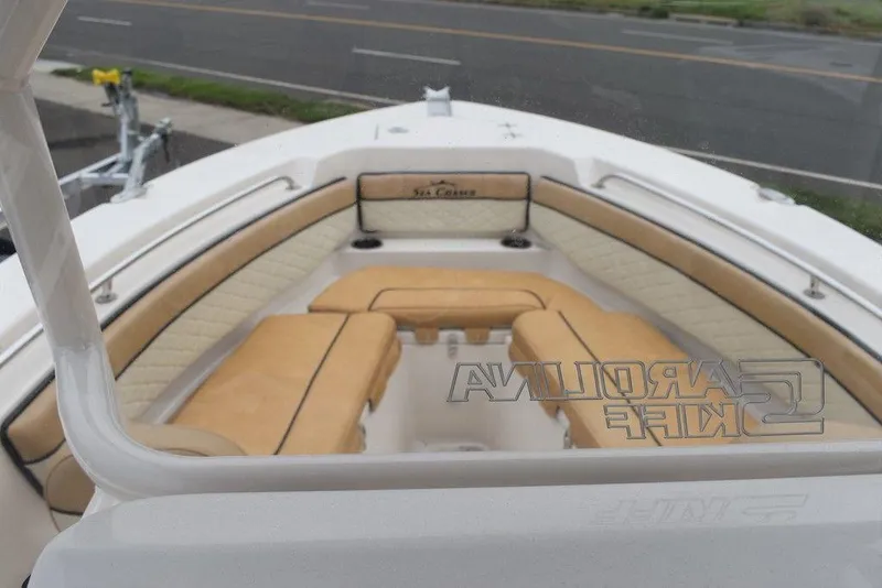 Slide: The Image of 2023 Sea Chaser 22 HFC boat with tan seating and white interior. - 8