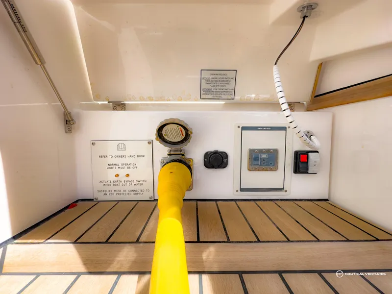 Slide: The Image of Fairline Targa 45 Open 2023 yacht fuel and control panel with yellow hose. - 24