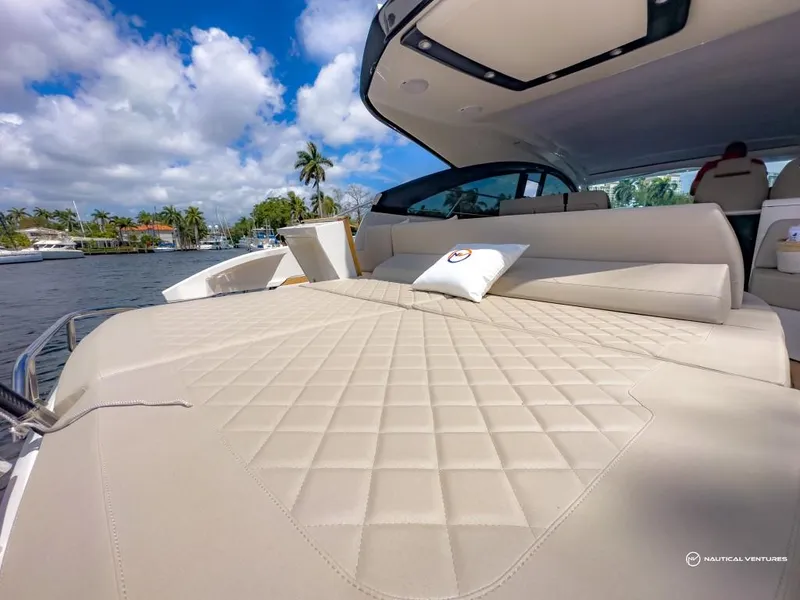 Slide: The Image of 2023 Fairline Targa 45 Open luxury yacht with spacious sunbed and scenic water view. - 25