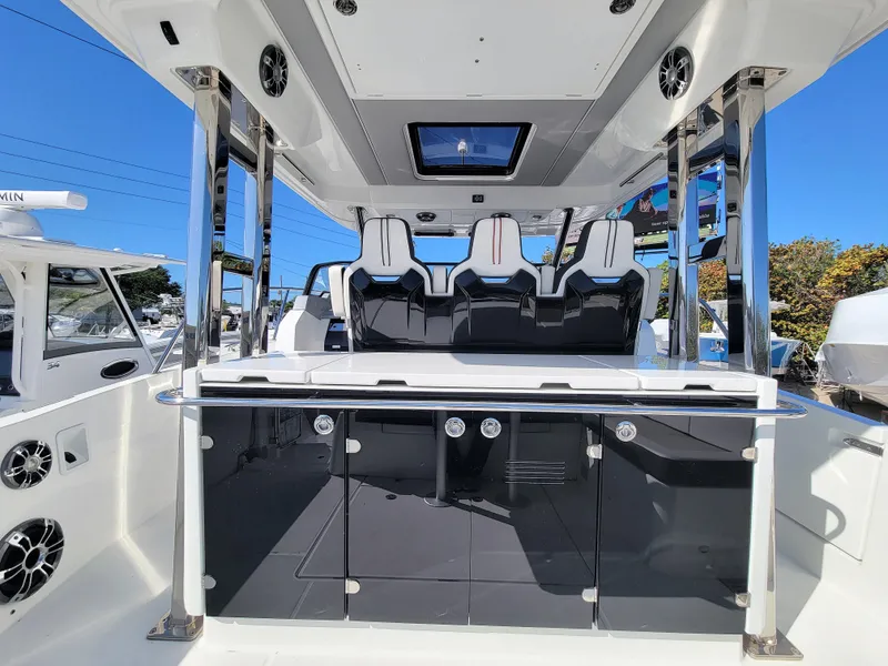 Slide: The Image of 2024 Jeanneau Leader 12.5 WA boat interior with seating and storage. - 15