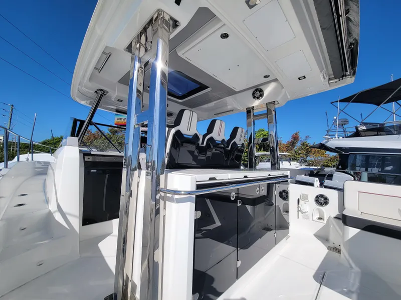 Slide: The Image of 2024 Jeanneau Leader 12.5 WA boat interior with modern seating and sleek design. - 16