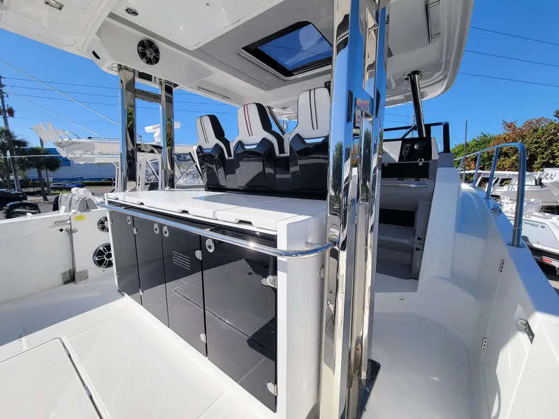 Slide: The Image of 2024 Jeanneau Leader 12.5 WA boat interior with seating and storage compartments. - 17