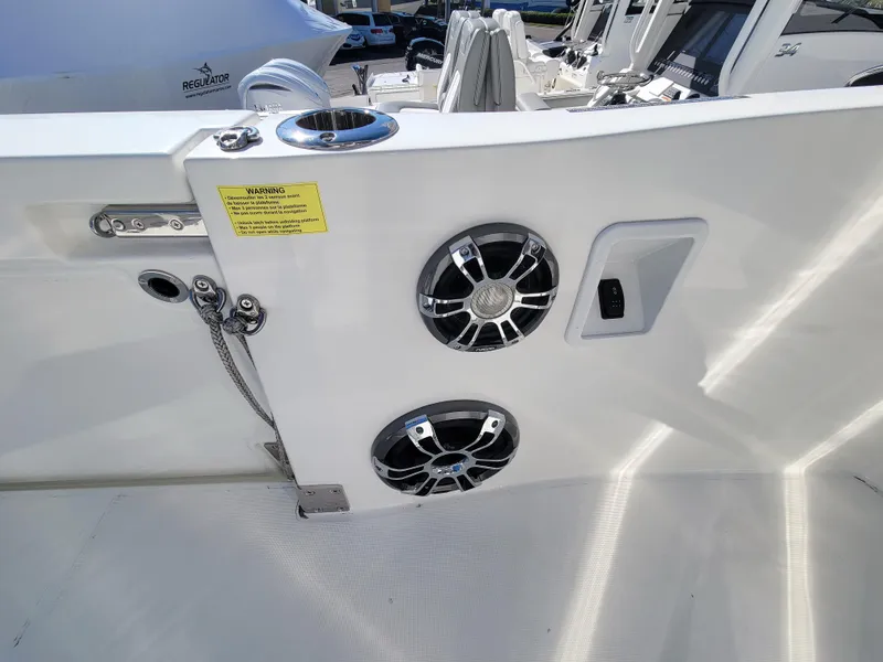 Slide: The Image of 2024 Jeanneau Leader 12.5 WA boat deck with speakers and cup holder. - 21
