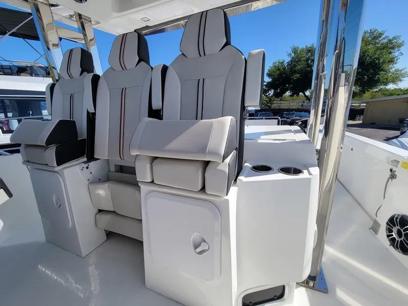 Slide: The Image of 2024 Jeanneau Leader 12.5 WA cockpit seating with cup holders. - 22