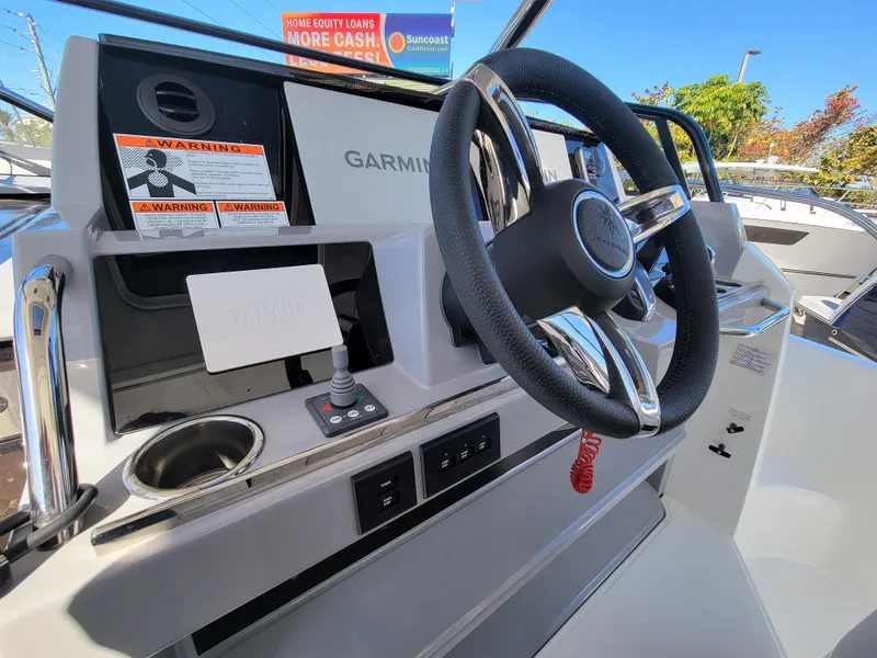 Slide: The Image of 2024 Jeanneau Leader 12.5 WA helm with Garmin navigation system. - 29