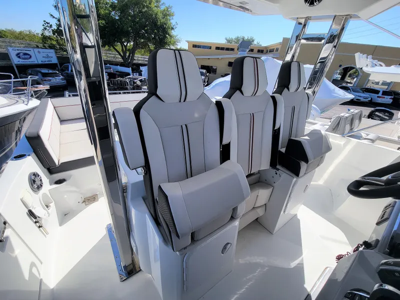 Slide: The Image of 2024 Jeanneau Leader 12.5 WA cockpit with three luxury seats. - 30