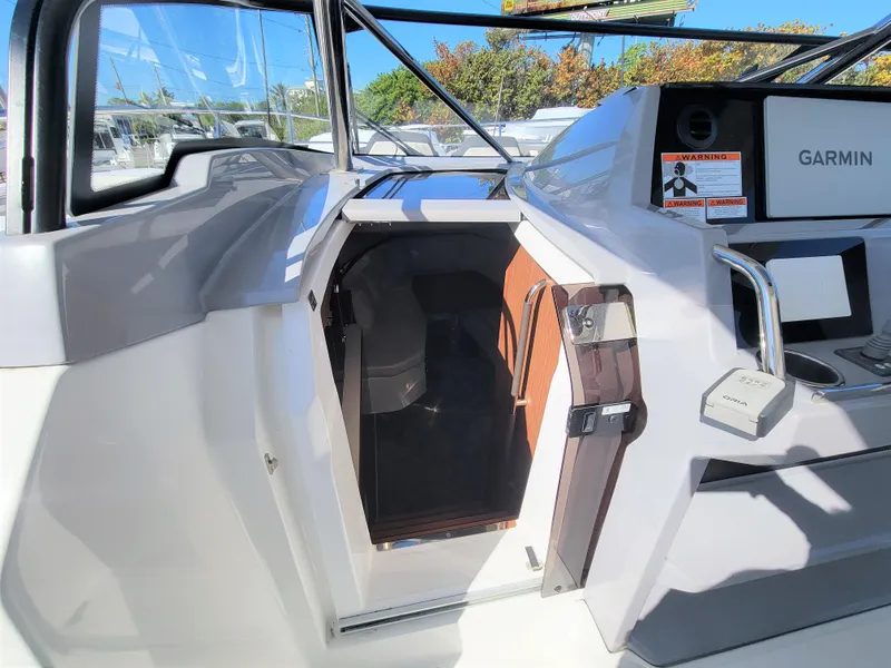 Slide: The Image of 2024 Jeanneau Leader 12.5 WA cabin entrance with Garmin navigation system. - 39