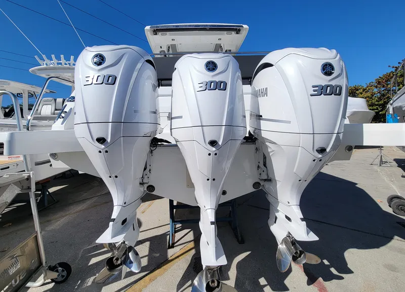 Slide: The Image of Triple Yamaha 300 engines on a 2024 Jeanneau Leader 12.5 WA boat. - 4