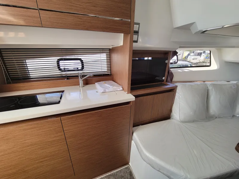 Slide: The Image of 2024 Jeanneau Leader 12.5 WA interior with modern kitchen and seating area. - 41