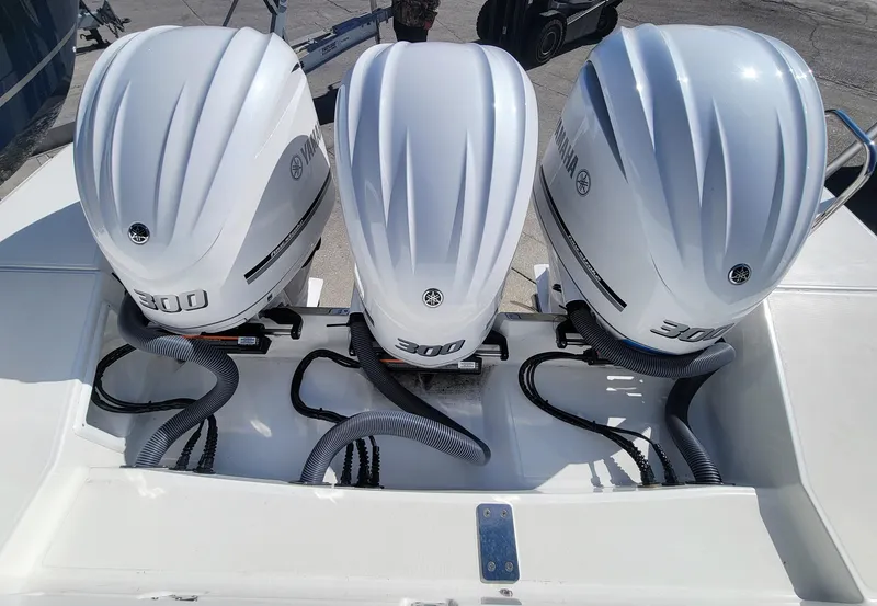 Slide: The Image of 2024 Jeanneau Leader 12.5 WA with triple 300 horsepower outboard engines. - 6