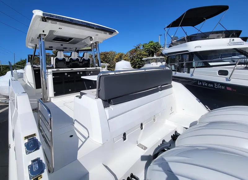 Slide: The Image of 2024 Jeanneau Leader 12.5 WA boat with spacious deck and seating. - 8
