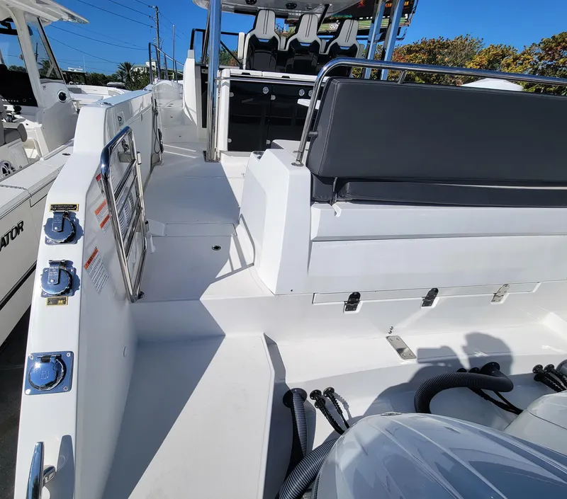Slide: The Image of 2024 Jeanneau Leader 12.5 WA boat interior with seating and control panel. - 9