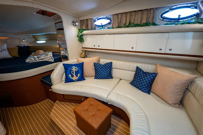 Slide: The Image of Luxurious interior of 1997 Sea Ray 330 Sundancer yacht with elegant seating and nautical decor. - 33