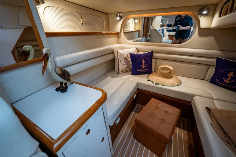 Slide: The Image of Interior of 1997 Sea Ray 330 Sundancer yacht with cozy seating and nautical decor. - 34