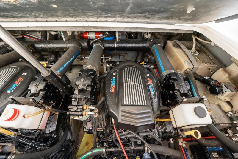 Slide: The Image of Engine compartment of a 1997 Sea Ray 330 Sundancer, showcasing dual inboard motors. - 41