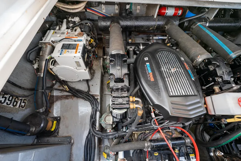 Slide: The Image of Engine compartment of a 1997 Sea Ray 330 Sundancer boat, showcasing mechanical components. - 43