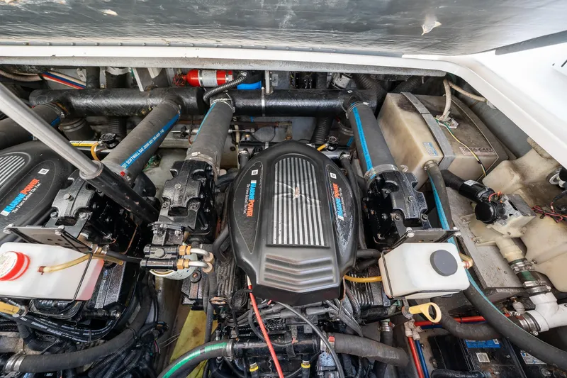 Slide: The Image of Engine compartment of a 1997 Sea Ray 330 Sundancer boat, showcasing dual engines and components. - 45