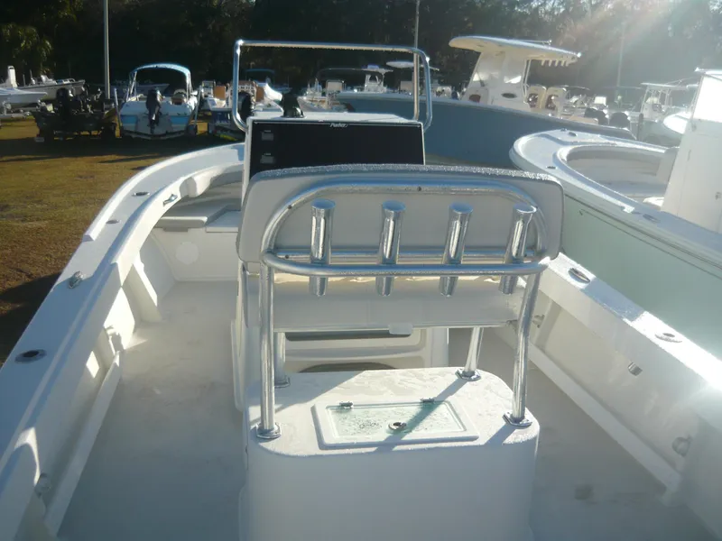 Slide: The Image of 2023 Parker 21 SE boat interior with center console and rod holders. - 3