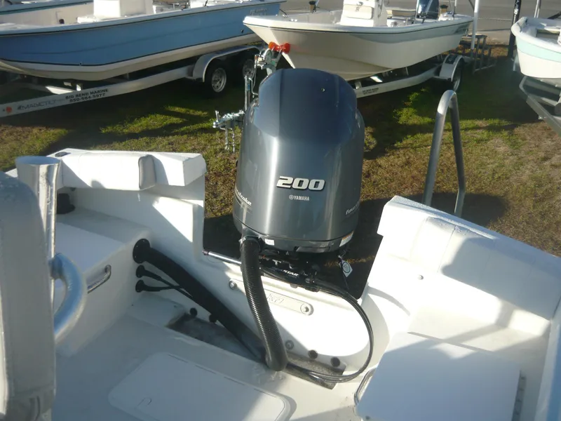 Slide: The Image of Parker 21 SE 2023 boat with Yamaha 200 outboard motor in a marina. - 7