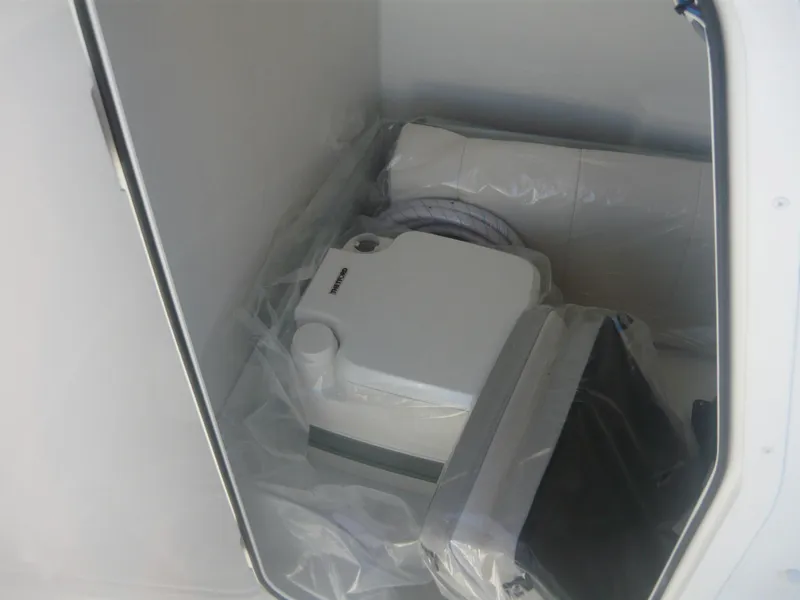 Slide: The Image of Storage compartment of 2023 Parker 21 SE boat with equipment. - 8