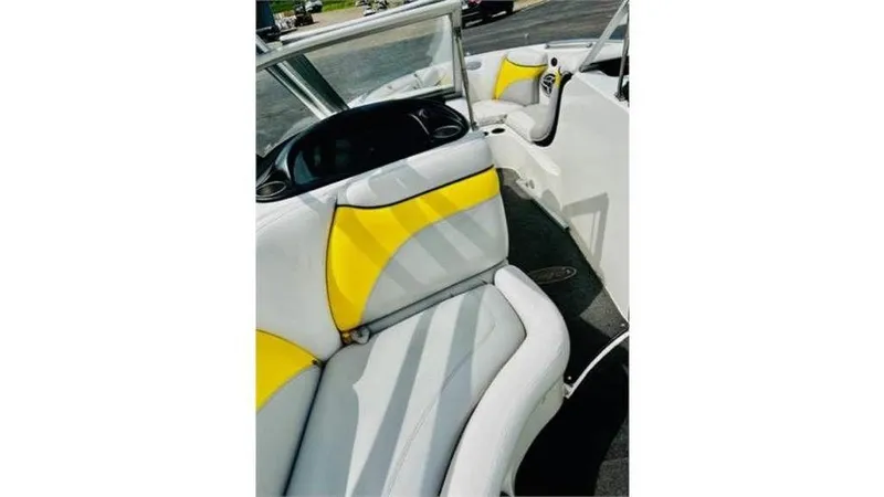 Slide: The Image of 2006 Tigé 22VE/SK boat interior with yellow and white seating. - 12