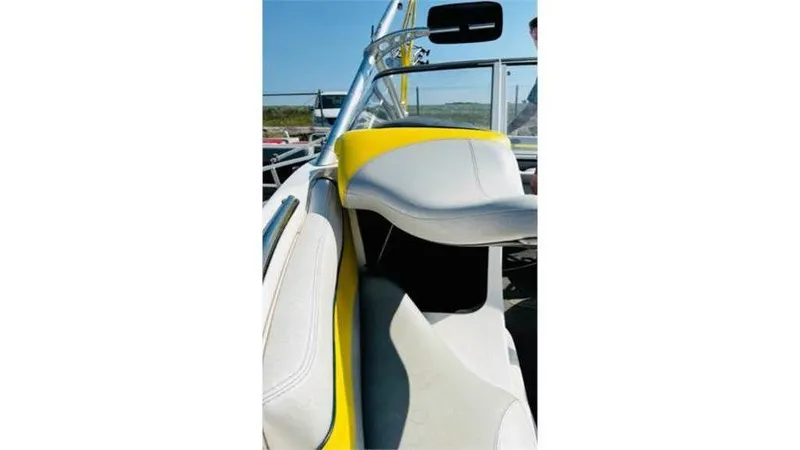 Slide: The Image of 2006 Tigé 22VE/SK STOCK#19026 boat interior with yellow and white seating. - 14