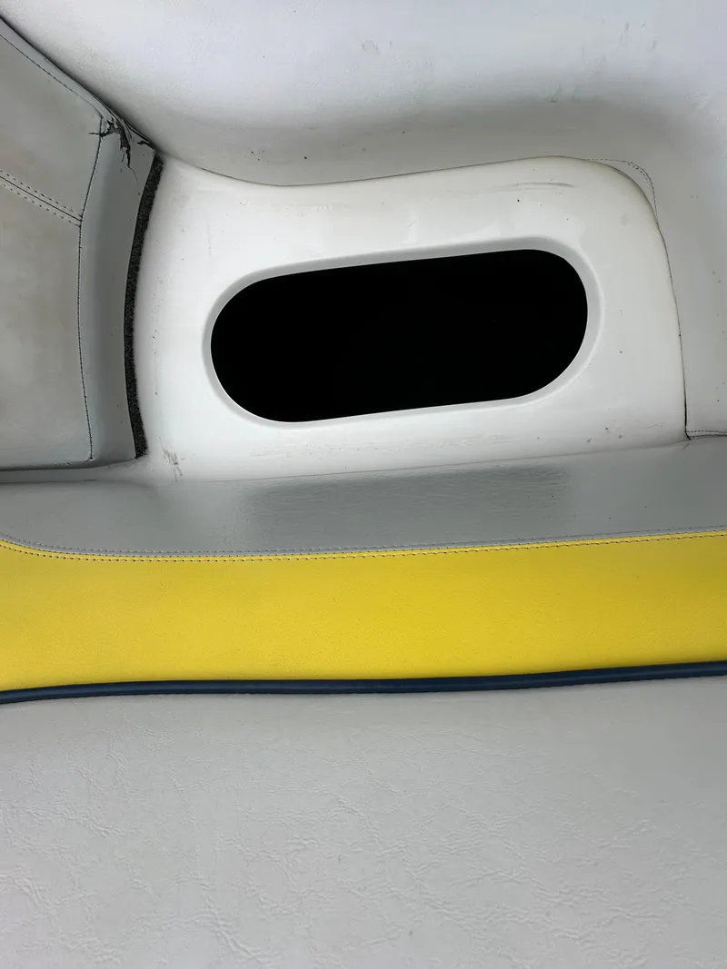 Slide: The Image of Interior detail of 2006 Tigé 22VE/SK boat, featuring yellow and white upholstery. - 18