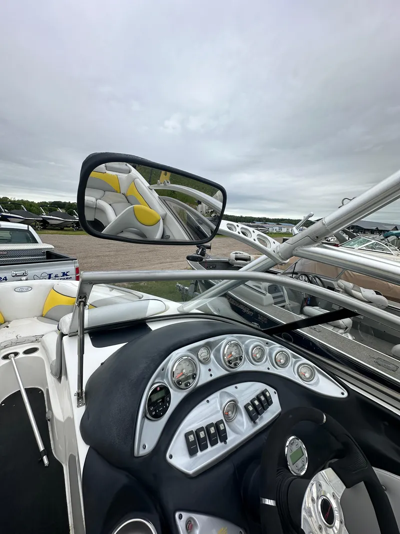 Slide: The Image of 2006 Tigé 22VE/SK boat dashboard and rearview mirror, stock #19026. - 24