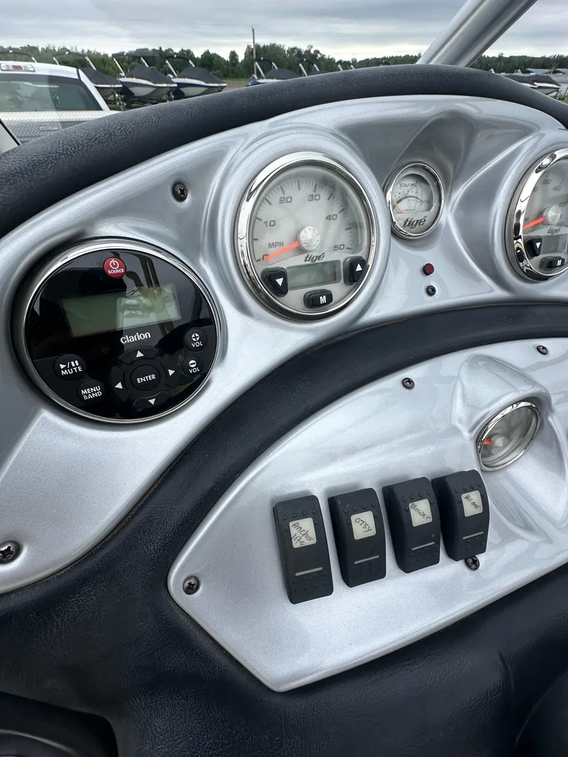 Slide: The Image of 2006 Tigé 22VE/SK boat dashboard with gauges and controls. - 28