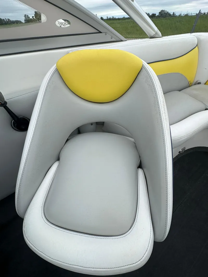 Slide: The Image of 2006 Tigé 22VE/SK boat interior with yellow and white seating. - 32