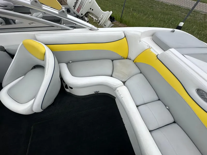 Slide: The Image of 2006 Tigé 22VE/SK STOCK#19026 boat interior with yellow and white seating. - 34