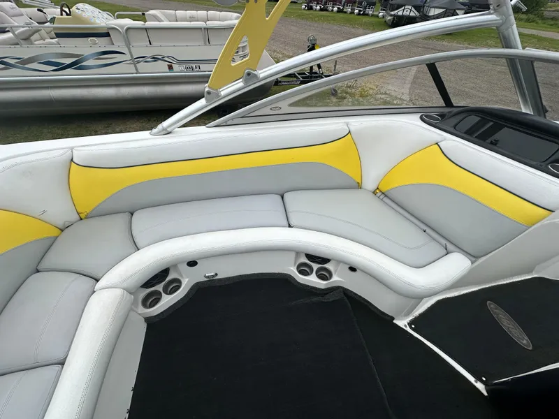 Slide: The Image of 2006 Tigé 22VE/SK STOCK#19026 boat interior with yellow and white seating. - 35