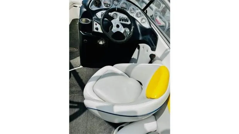 Slide: The Image of 2006 Tigé 22VE/SK STOCK#19026 boat cockpit with steering wheel and captain's seat. - 4