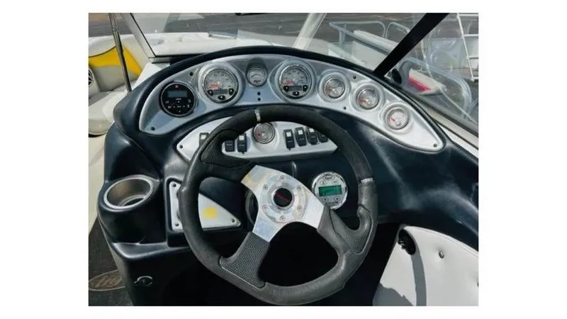 Slide: The Image of 2006 Tigé 22VE/SK STOCK#19026 boat dashboard with steering wheel and gauges. - 5