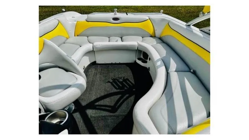 Slide: The Image of 2006 Tigé 22VE/SK STOCK#19026 boat interior with yellow and white seating. - 6