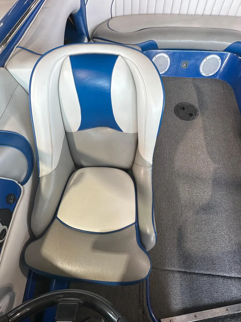 Slide: The Image of 2016 Sanger V215 boat interior with blue and white seating. - 14
