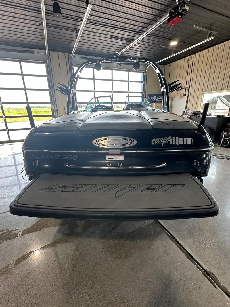 Slide: The Image of 2016 Sanger V215 boat in a garage, rear view. - 21