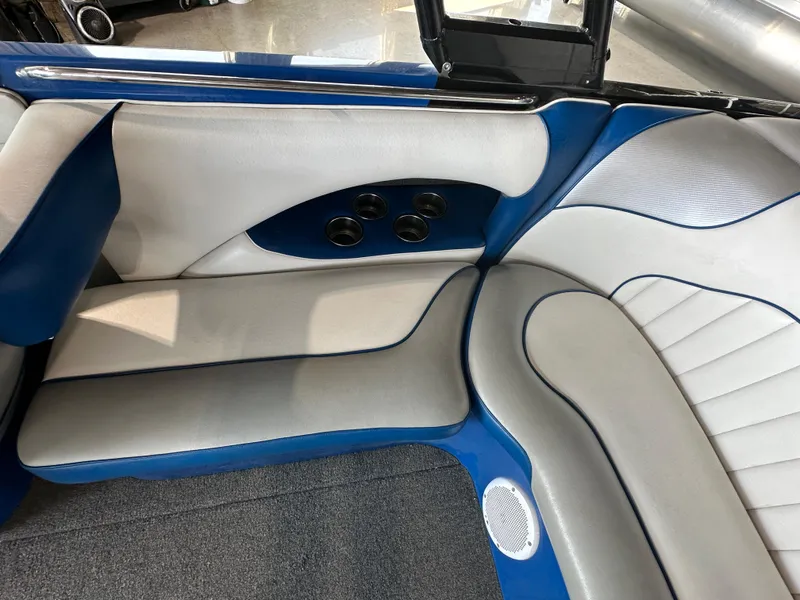 Slide: The Image of 2016 Sanger V215 boat interior with blue and white seating. - 6