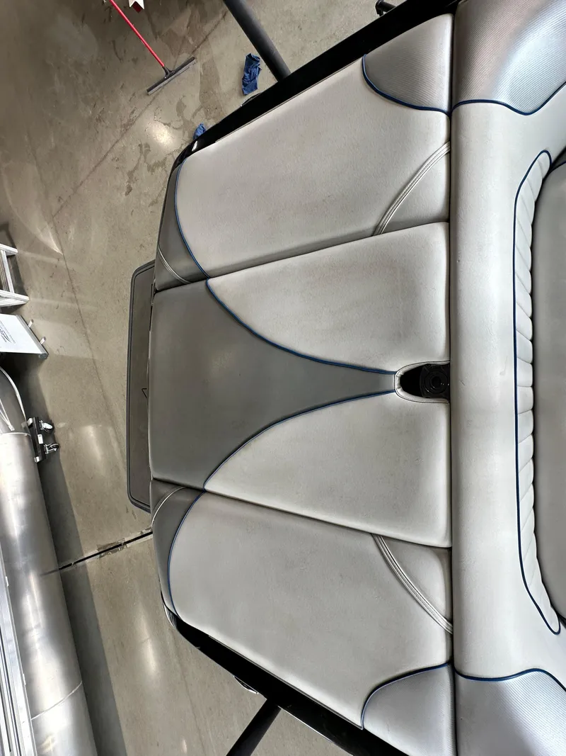 Slide: The Image of 2016 Sanger V215 boat interior with sleek, modern upholstery design. - 7