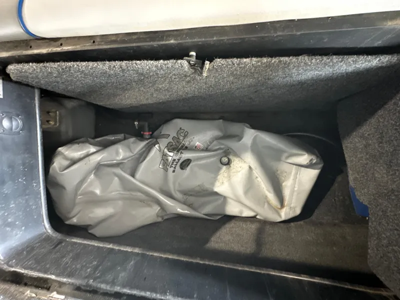 Slide: The Image of Storage compartment of a 2016 Sanger V215 boat with a ballast bag. - 8