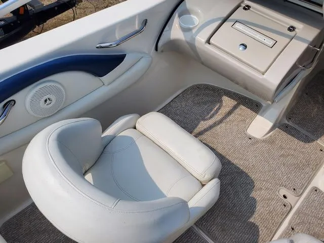 Slide: The Image of 2008 Larson 180 Sport boat interior with white seating and carpeted floor. - 10